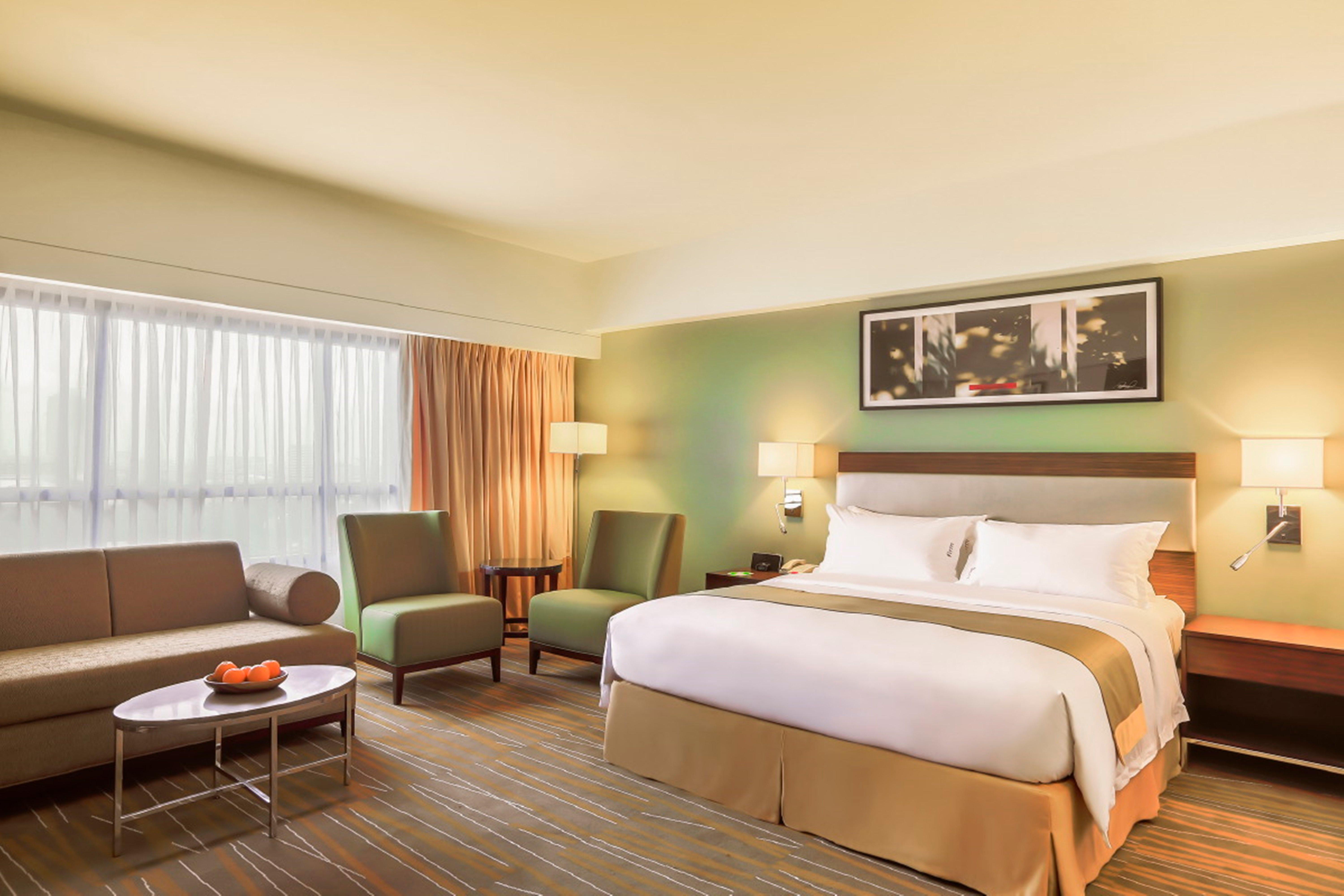 Holiday Inn & Suites Makati By Ihg San Pedro Makati Exterior foto A typical room at the Holiday Inn